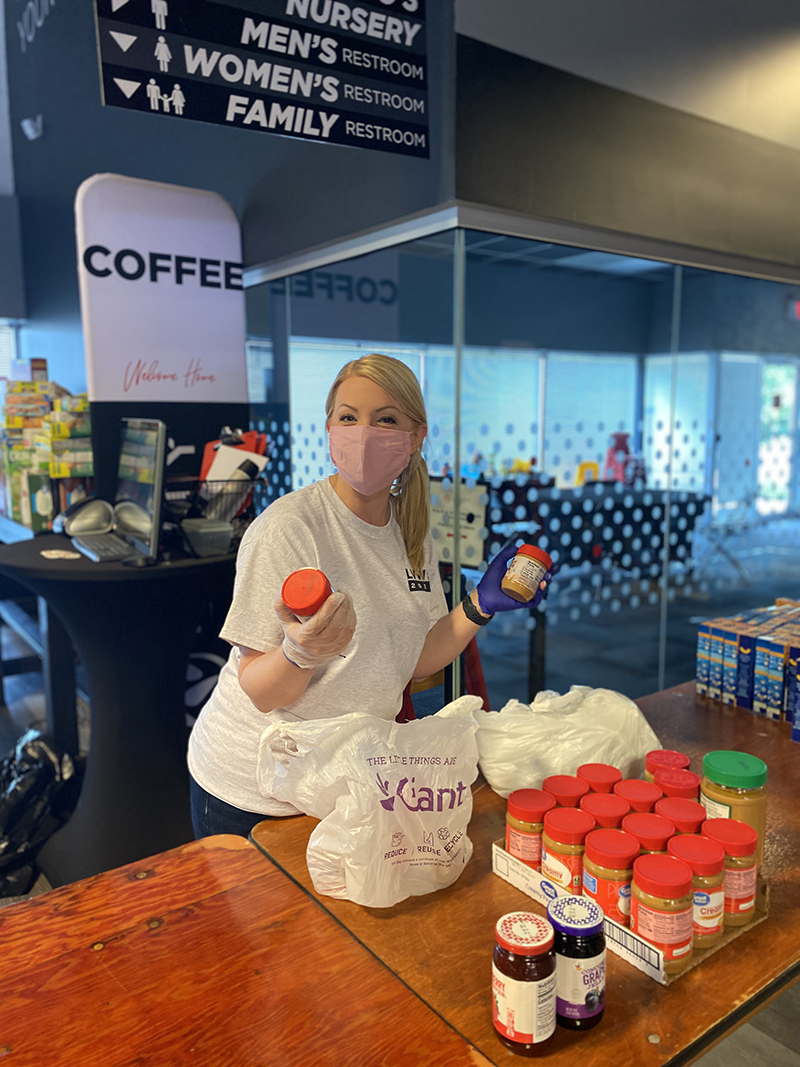 Woman working at food bank. Sandy Spring Bank Community Efforts.