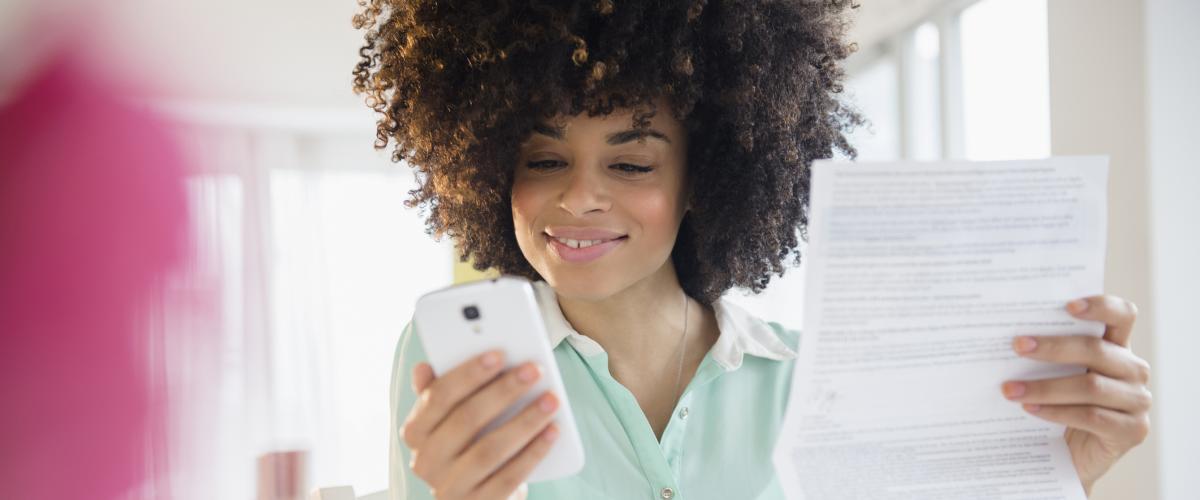 Happy woman smiling at her cell phone. Online Banking. In today’s 24/7 world, you need online banking that is fast, easy to use, and secure. Sandy Spring Bank Personal Online Banking is all that—and more. 