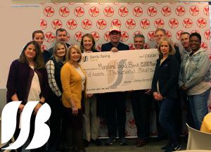 Sandy Spring Bank Employees Donates 15,000 Meals - shown as a check- to the Maryland Food Bank